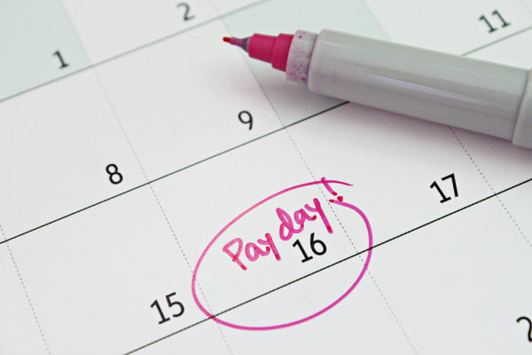 "Payday" written on a calendar and circled in red ink.
